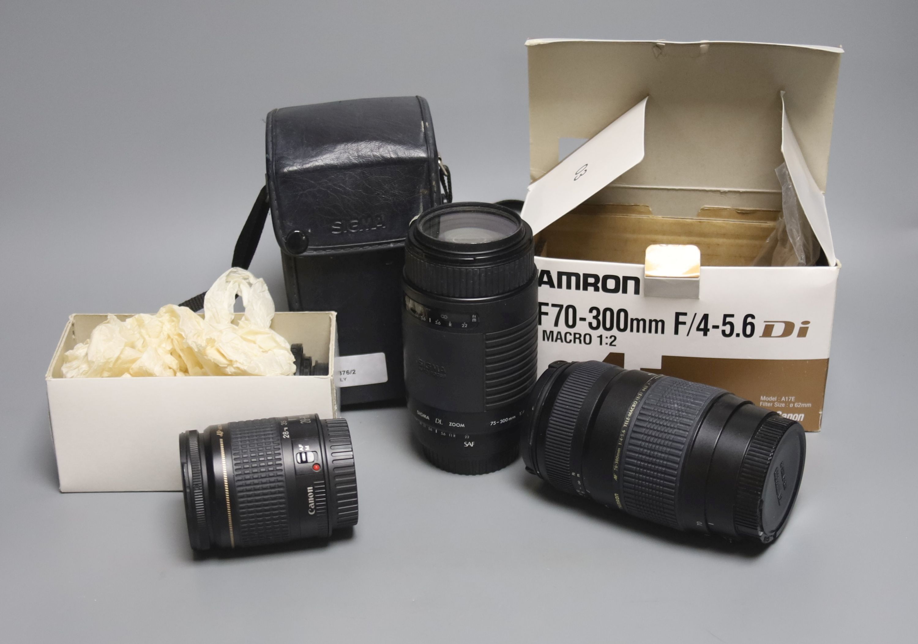 A Tamron AF70-300mm F/4-5.6 Di LD Macro 1:2 camera lens, a Sigma DL Zoom lens and a Canon 28-80m lens